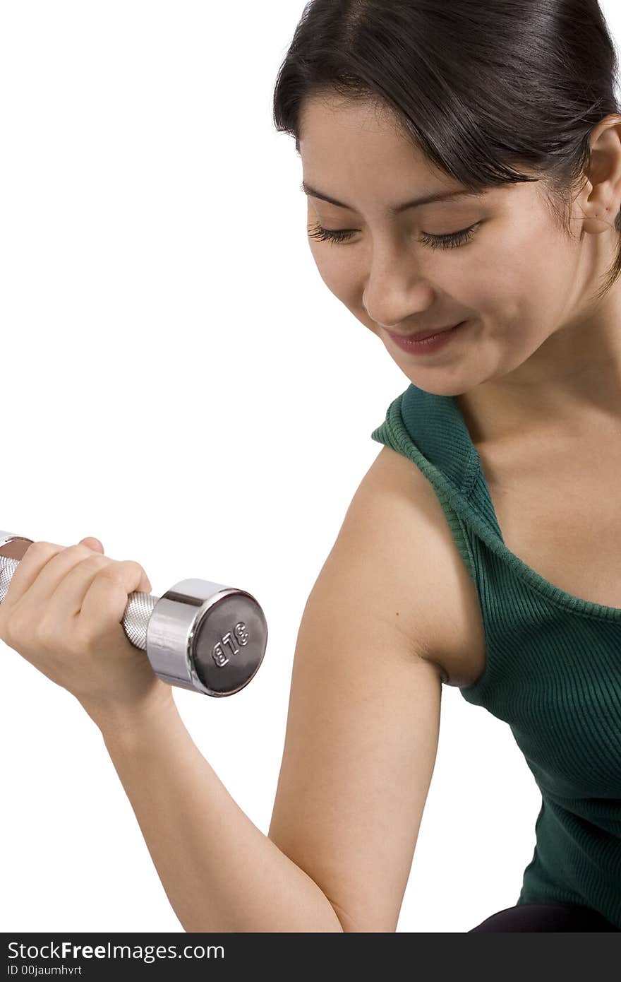 A young woman using weights over a white background. A young woman using weights over a white background