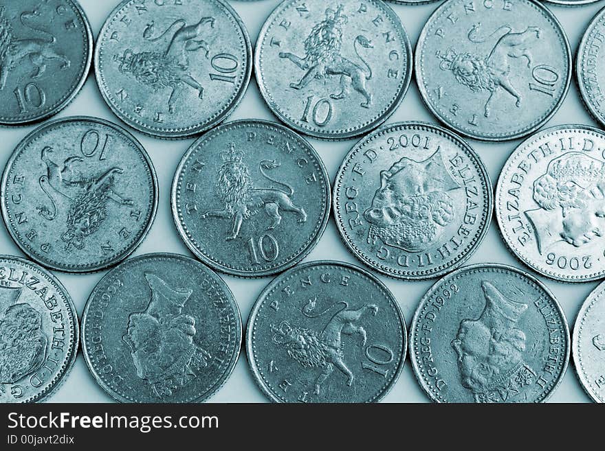 Silver ten pence pieces in a pattern