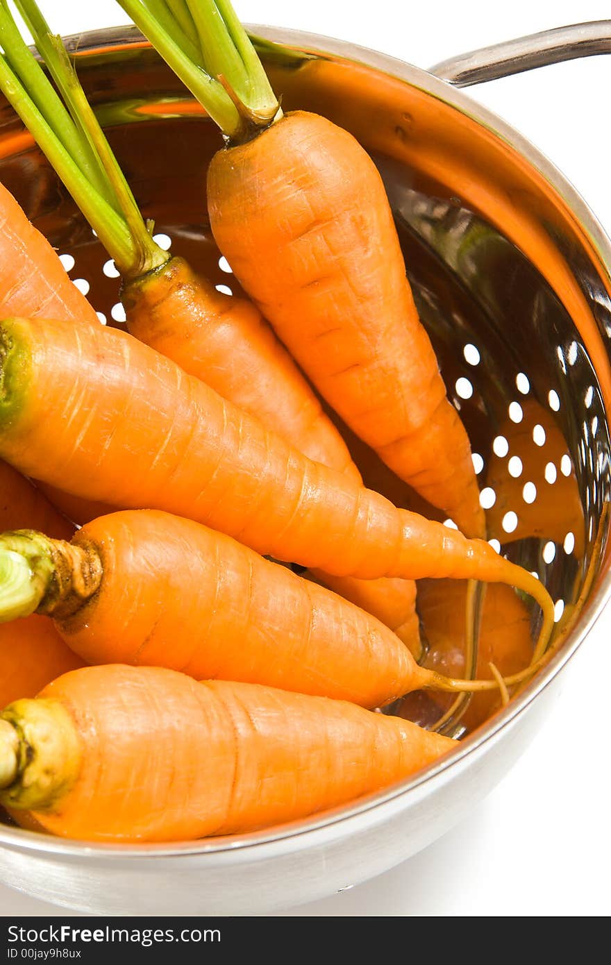 Fresh carrots in the colander