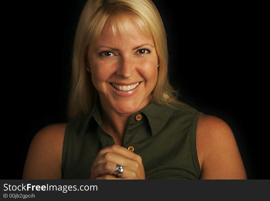 Attractive Blond Haired, Brown Eyed Woman on a Black Background. Attractive Blond Haired, Brown Eyed Woman on a Black Background.