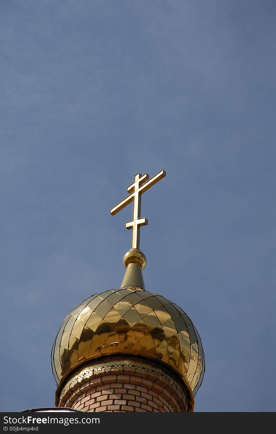 Russian golden church cupola with blue sky like background. Russian golden church cupola with blue sky like background