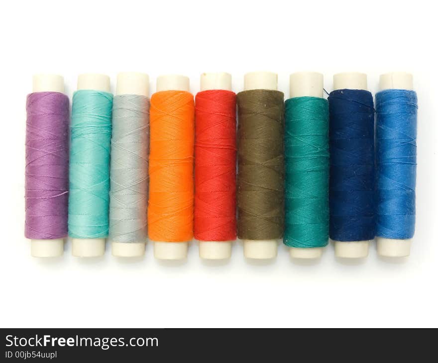 An isolated photo of several colourful threads