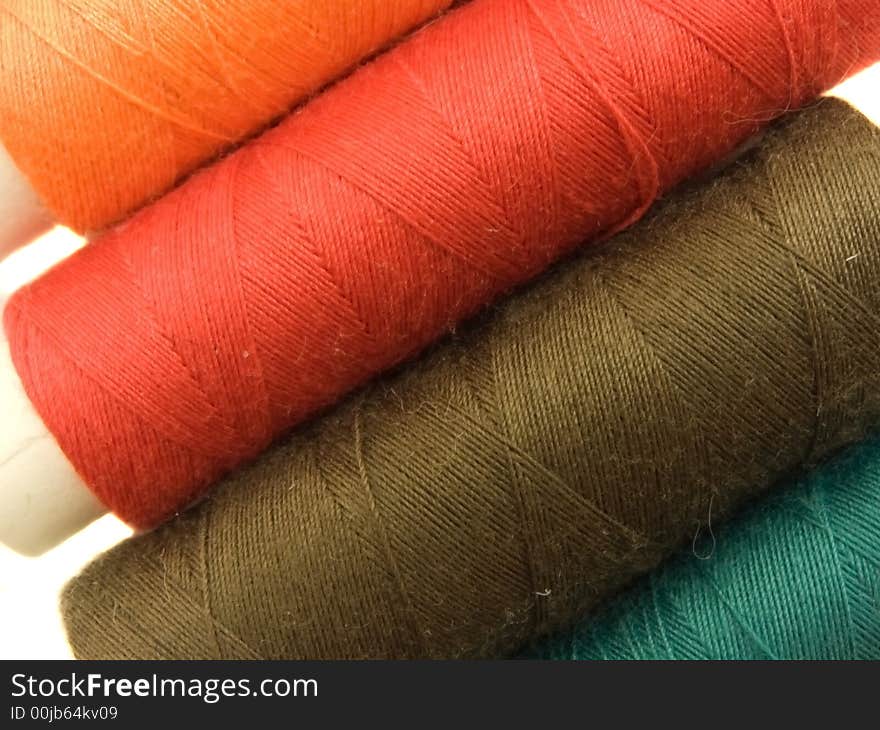 An isolated photo of several colourful threads