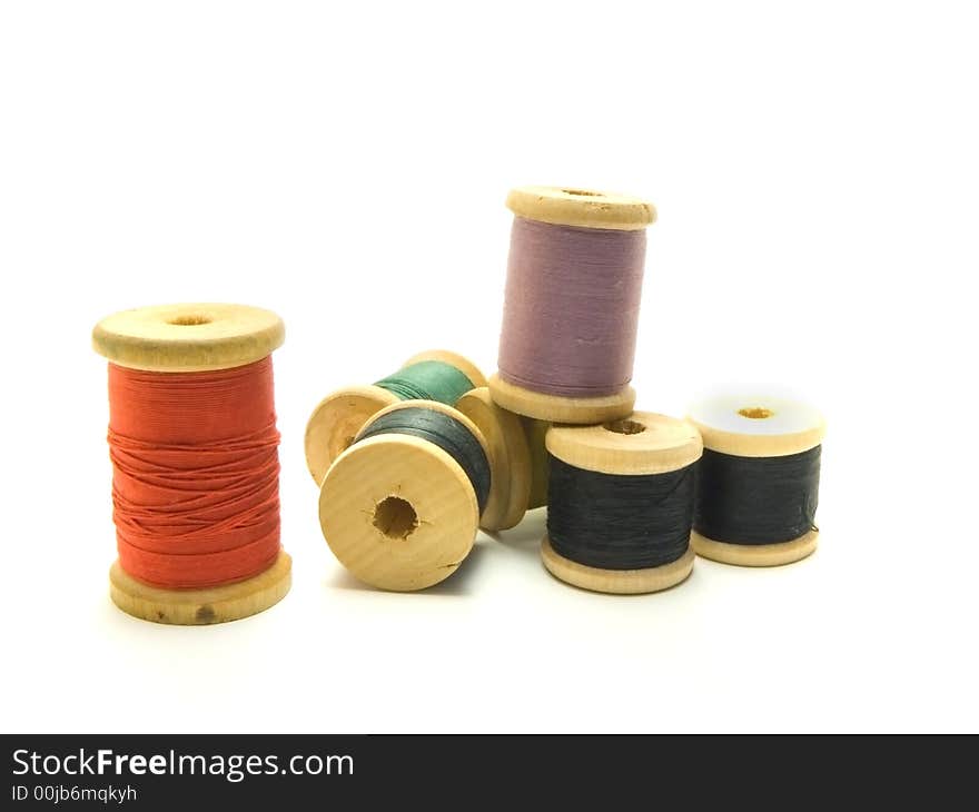 An isolated photo of several colourful threads