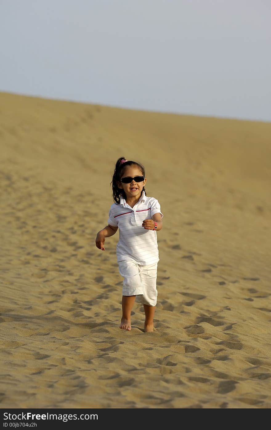 Happy child all alone in the desert. Happy child all alone in the desert