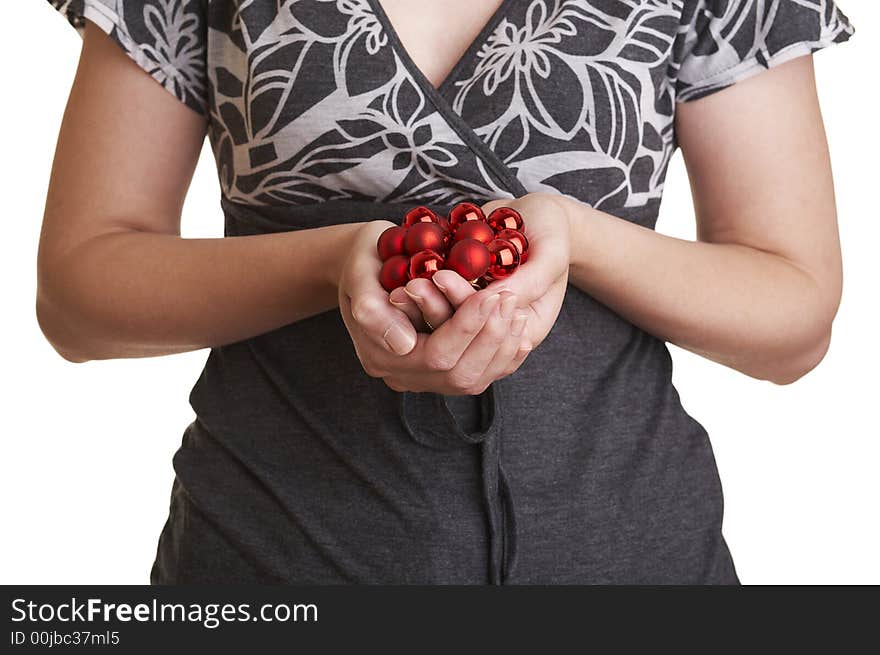 Girl with handful of christmas ornaments (red christmas balls). Girl with handful of christmas ornaments (red christmas balls).