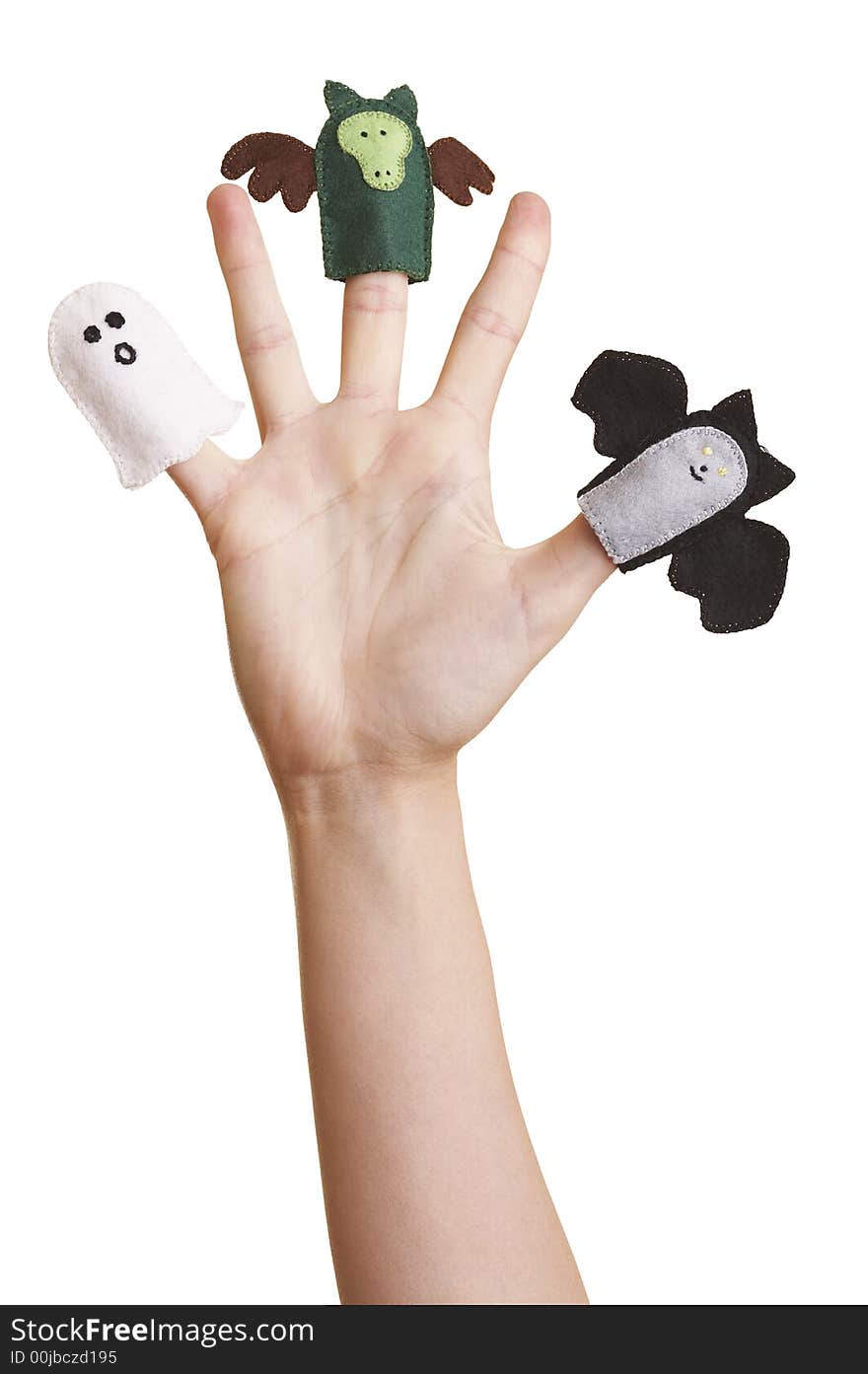 Girl's hand with halloween finger puppets (ghost, bat and dragon)