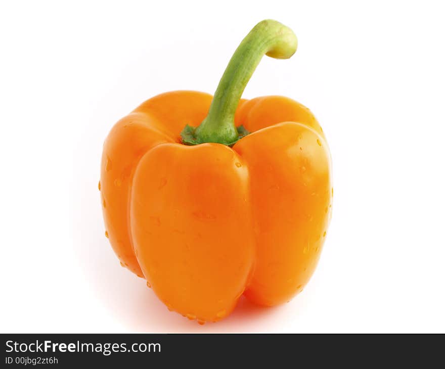 Fresh orange pepper bell with drops of water