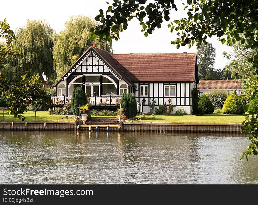 Timber Framed Riverside House and garden on the Banks of the River Thames in England. Timber Framed Riverside House and garden on the Banks of the River Thames in England