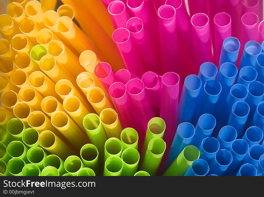 Multi-coloured straws grouped together (viewed from the end - macro).