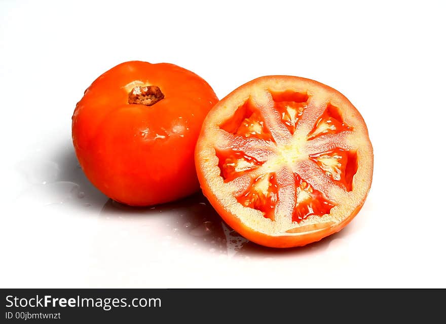 Fresh garden tomatoes on white