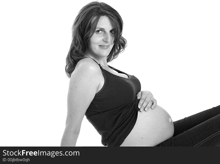 Beautiful woman smiling and holding her belly. Beautiful woman smiling and holding her belly.