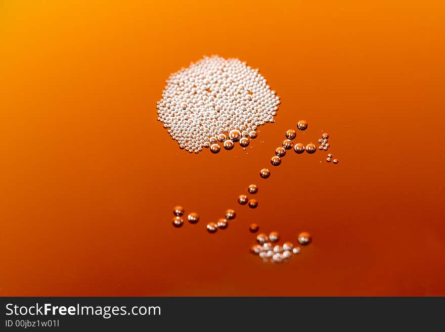 Close up shot of many bubbles on a drink surface.