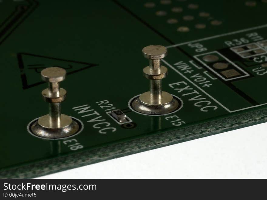 Close up detail of a Printed Circuit Board on a white background