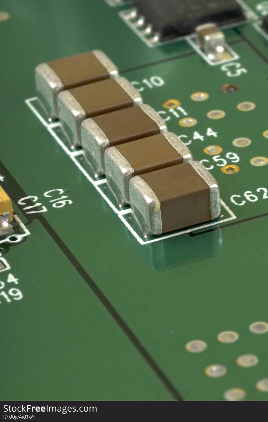 Close up detail of a Printed Circuit Board on a white background