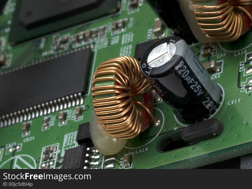 Close up detail of a Printed Circuit Board on a white background