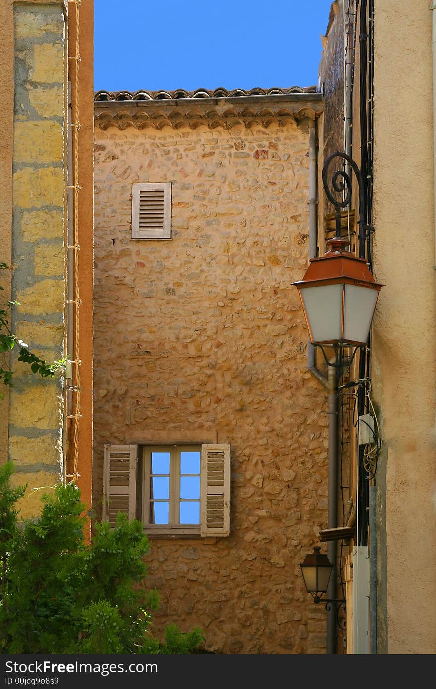 Mediterranean façades in an old village from the Middle Ages in the south of France.
