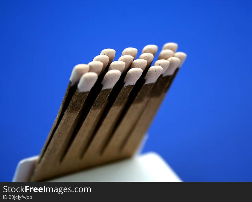 Open book of matches on a blue background. Open book of matches on a blue background