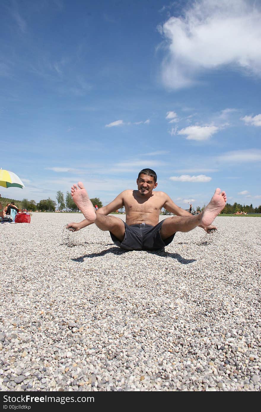 Young man enjoying his vocations on the beach. Young man enjoying his vocations on the beach