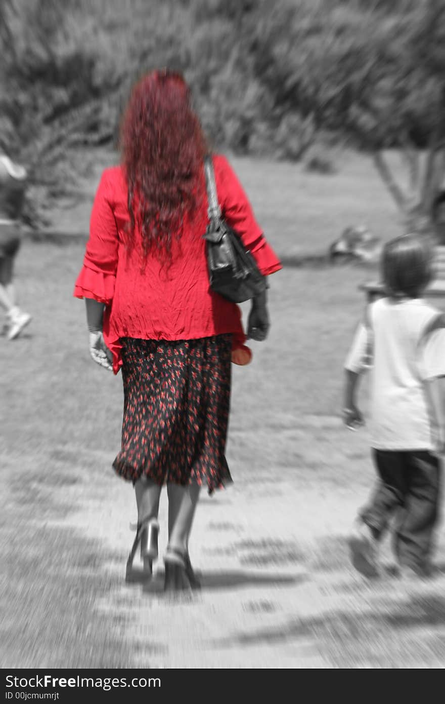 A beautiful lady in the park in Rome Italy / Red highlighted / B-N. A beautiful lady in the park in Rome Italy / Red highlighted / B-N