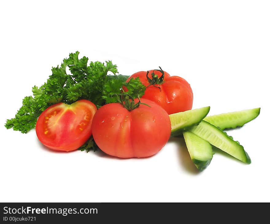 Cucumbers, tomatoes and greens, close up