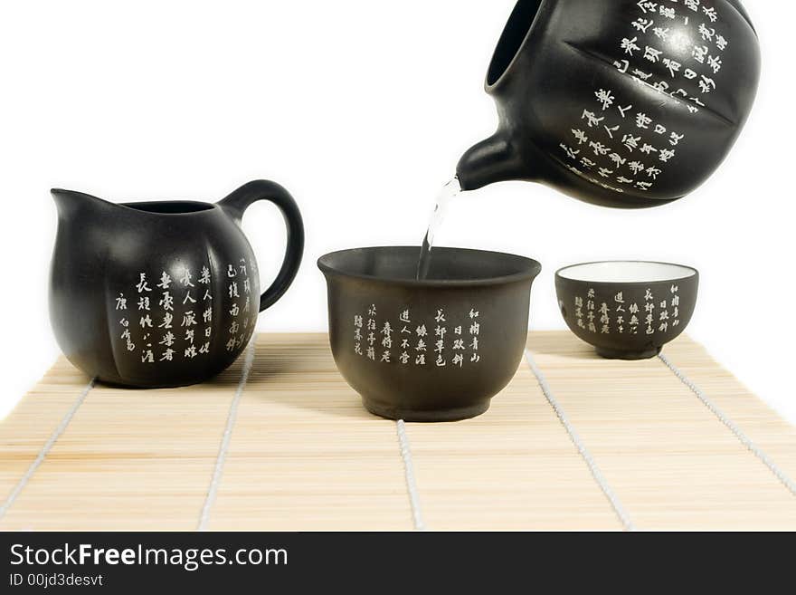 Black matte Chinese tea set with teapot and cup with chinese characters. Black matte Chinese tea set with teapot and cup with chinese characters.