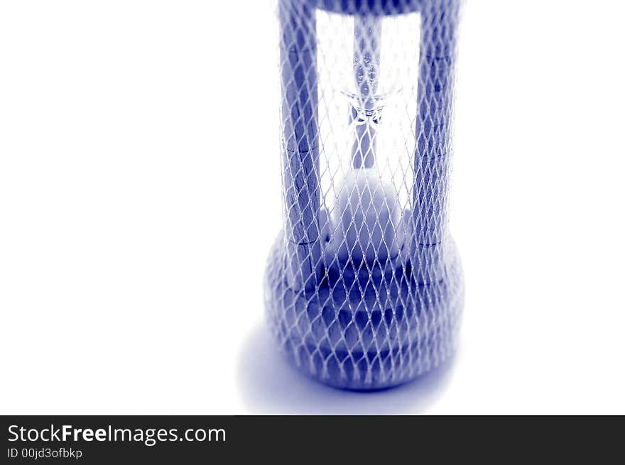 Hourglass covered by a net. Hourglass covered by a net