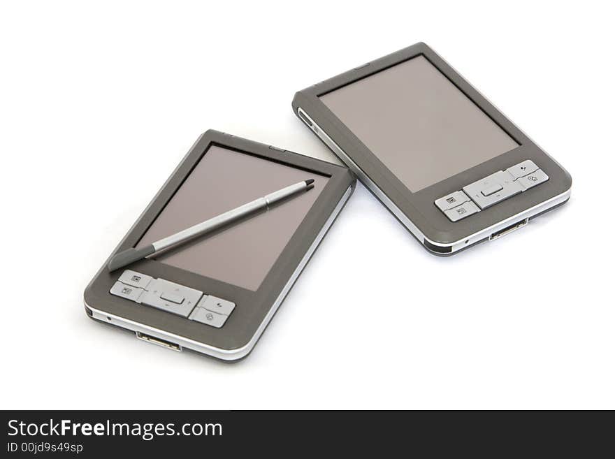 2 PDA's on white, isolated, with one having stylus on screen