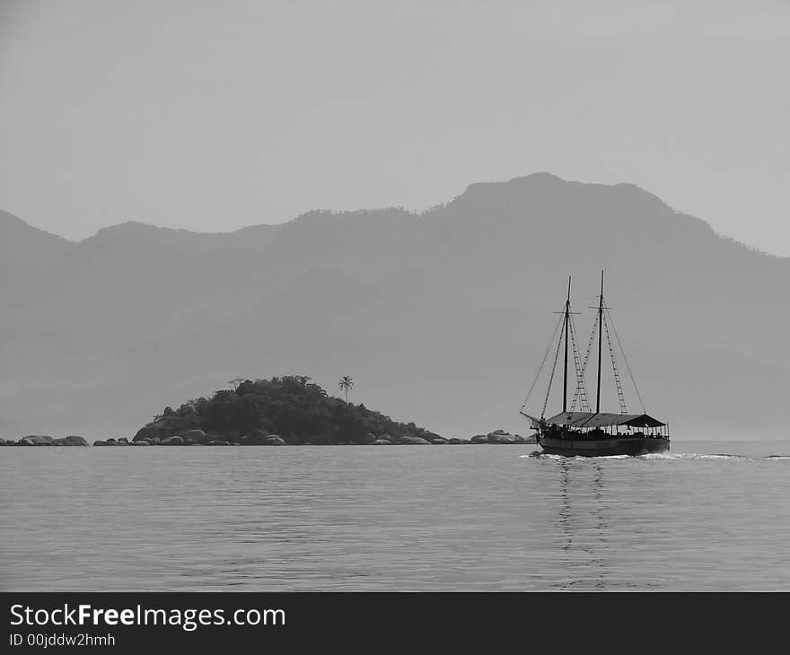 Boat nearby a small island. Boat nearby a small island