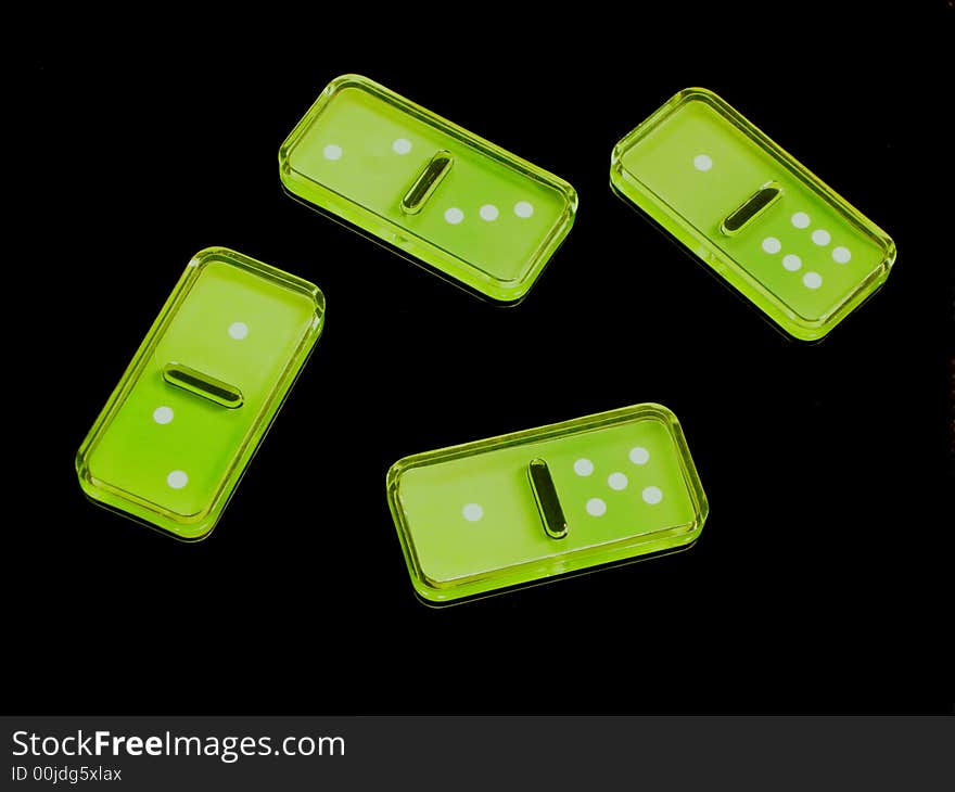 Domino green pieces in a black background