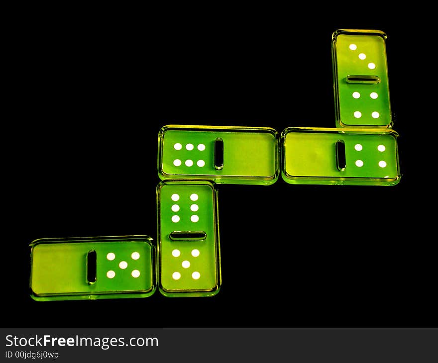 Domino green pieces in a black background