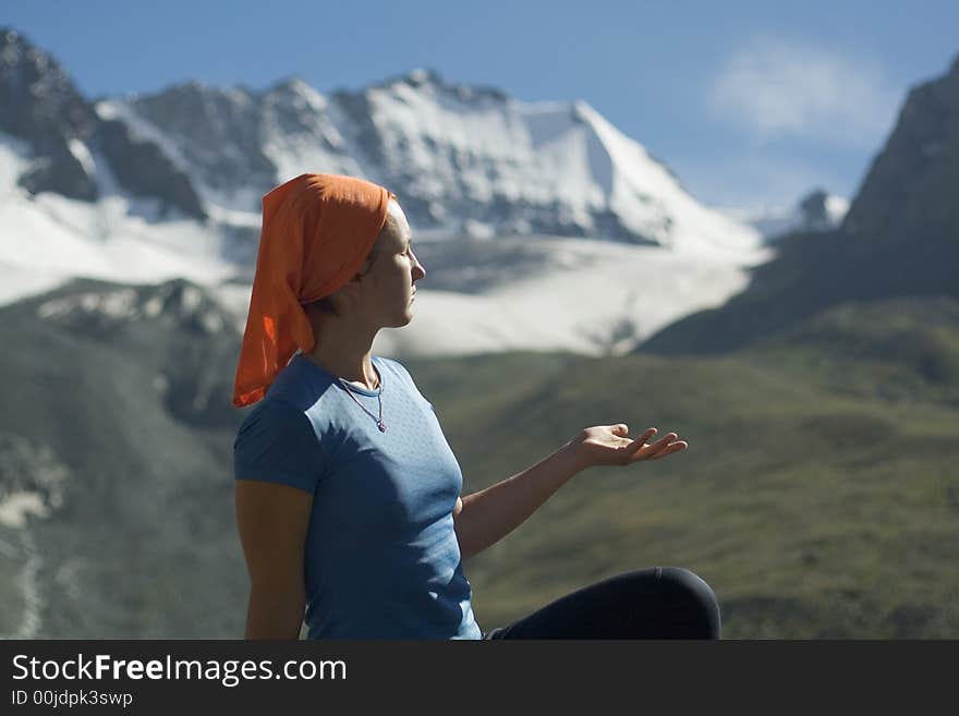 Relaxing girl in the mountains