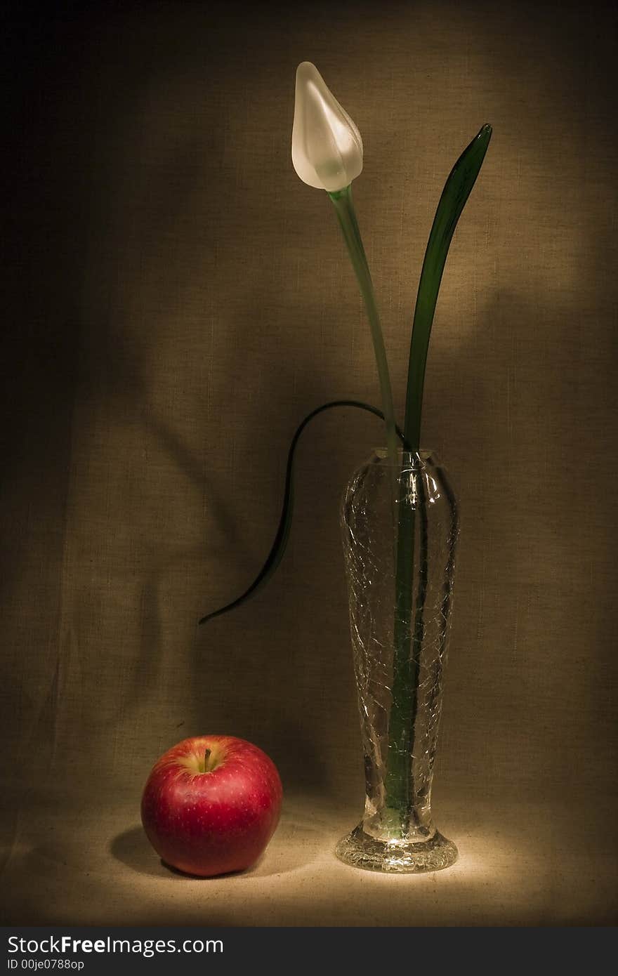 Glass flower and apple