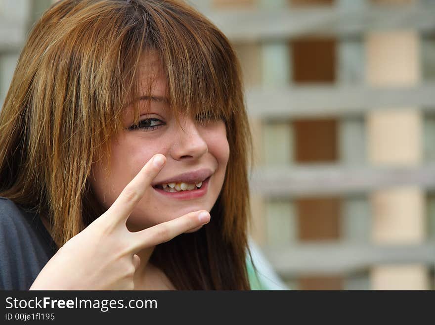 Beautiful girl with peace sign