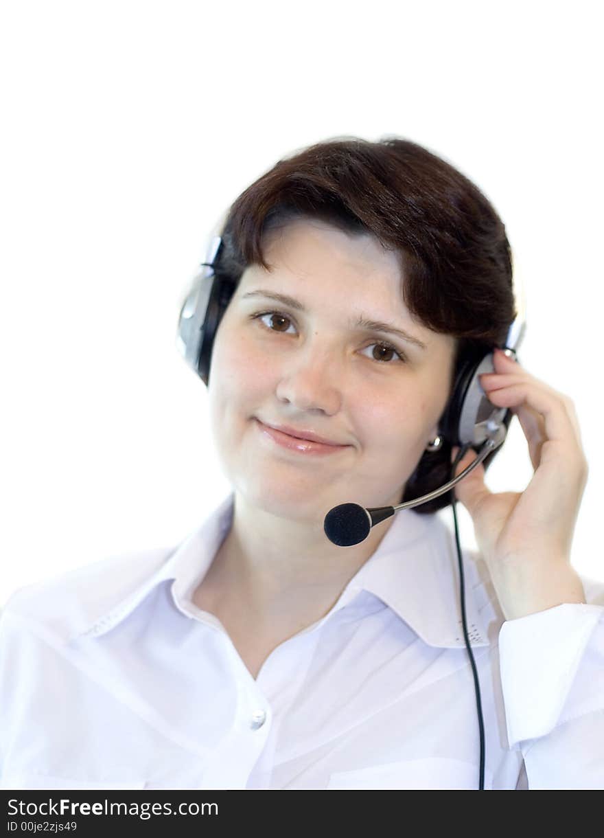 Attractive smiling woman with a headset on white. Attractive smiling woman with a headset on white