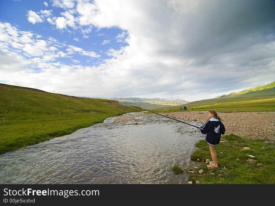 Smoll girl fishing on a river. Smoll girl fishing on a river