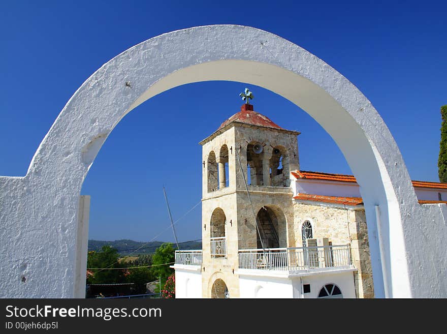 Arch with a church in the background