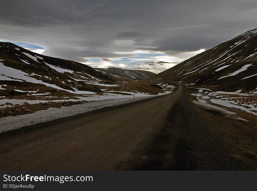 Deserted country road leading into the horizon