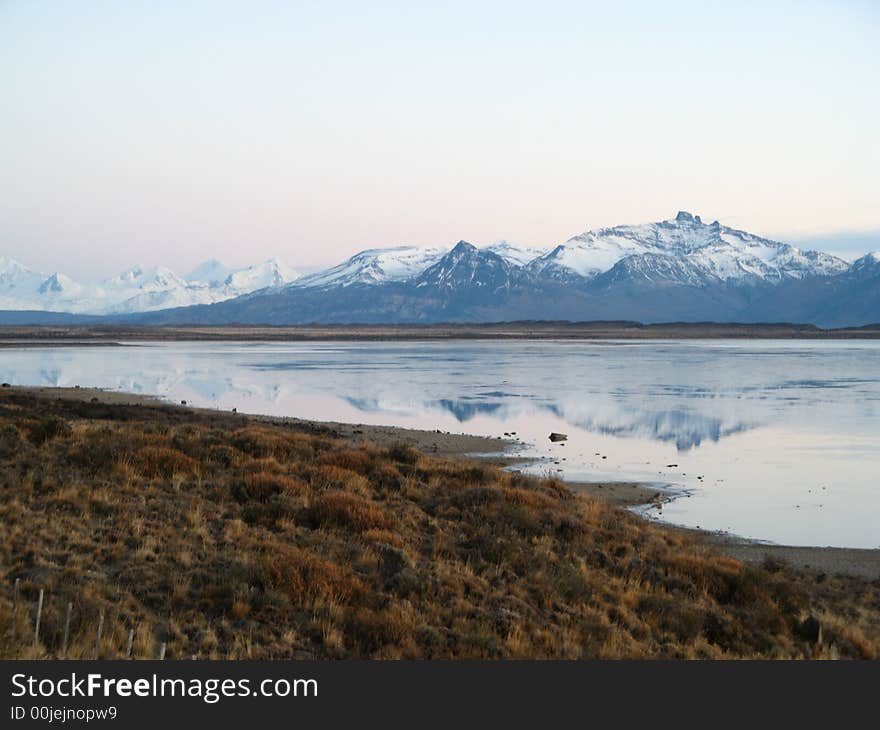 Reflections of snow-capped mountains over Argentina Lake. Reflections of snow-capped mountains over Argentina Lake.