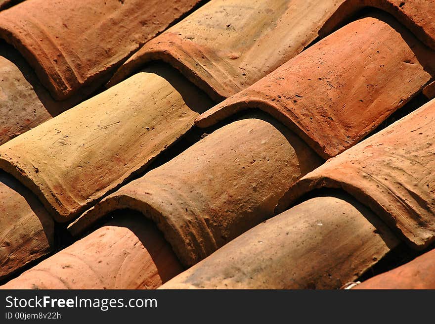 The tiled roof is lighted up a sun