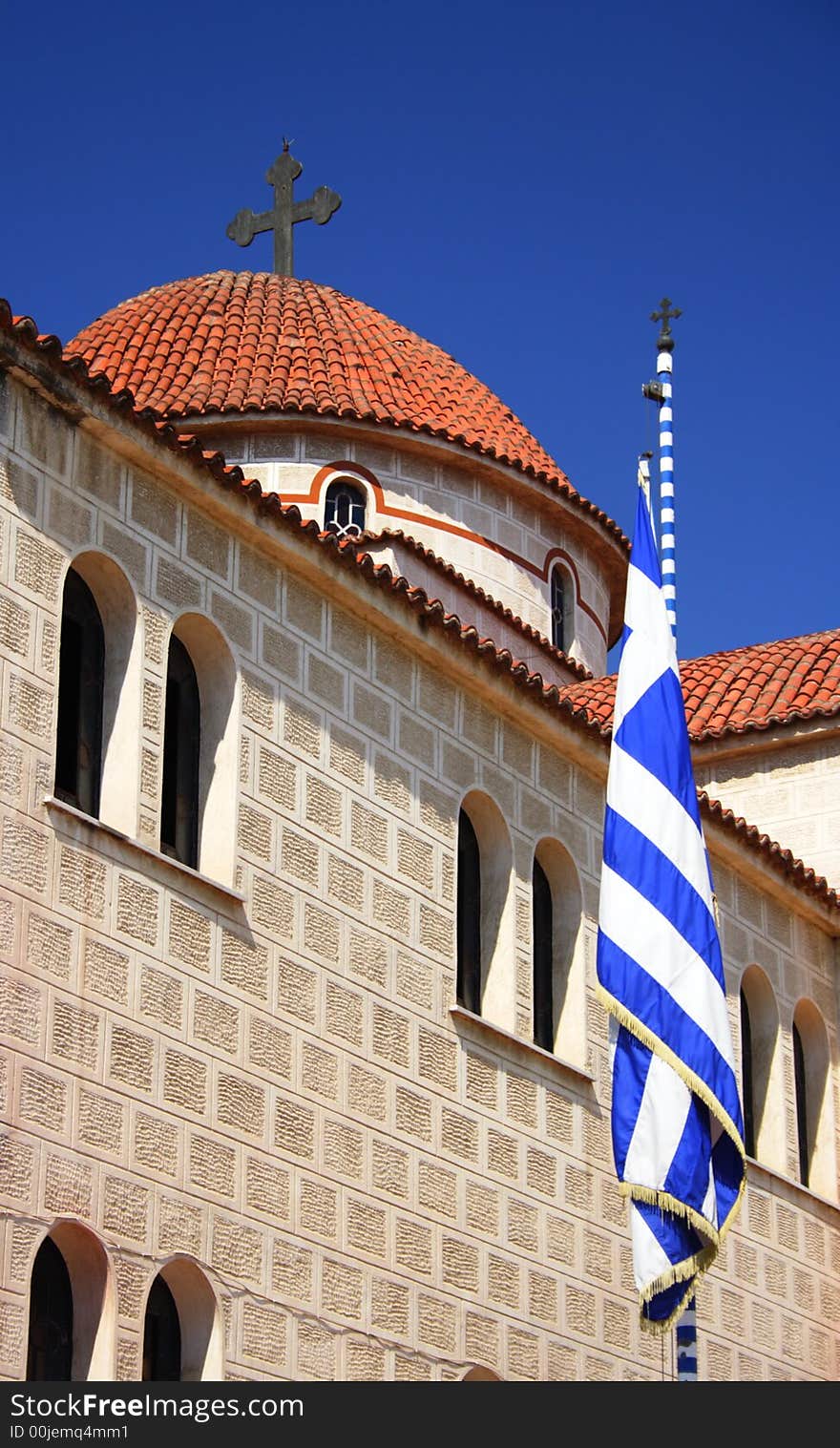 Orthodox church in Greece with a greek flag