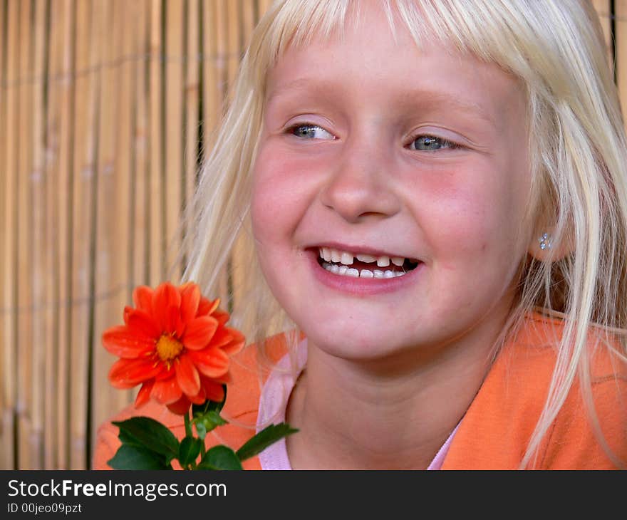 The girl without tooth and with a flower. The girl without tooth and with a flower.