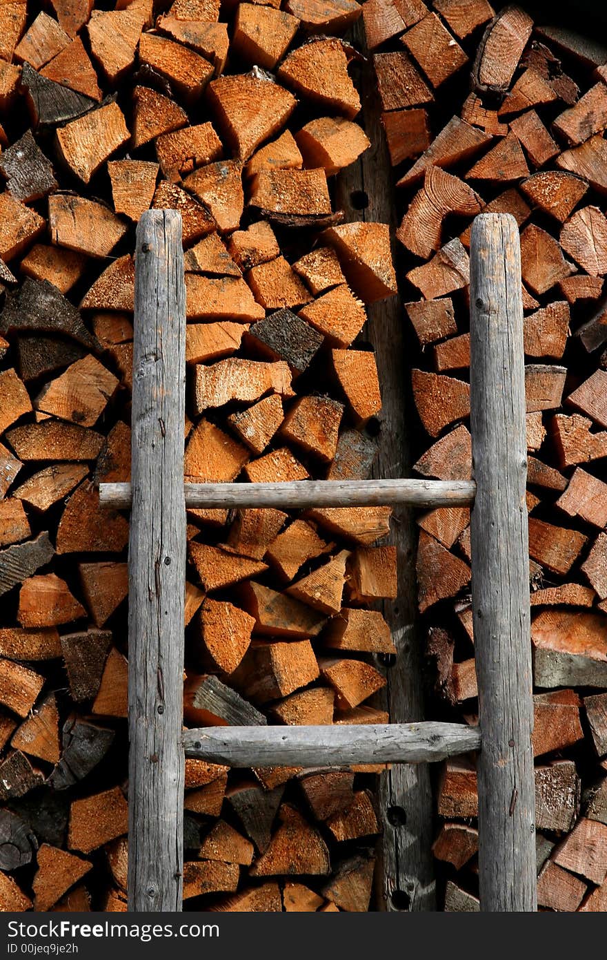 Image of a Firewood stack and ladder in Austrian Tirol. Image of a Firewood stack and ladder in Austrian Tirol