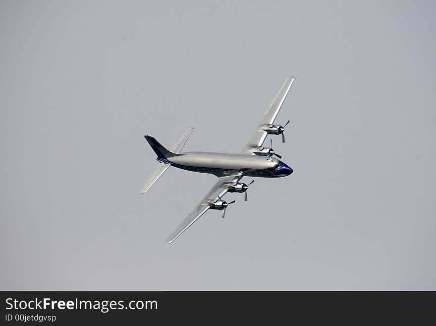 A big airplane fly on the airshow.