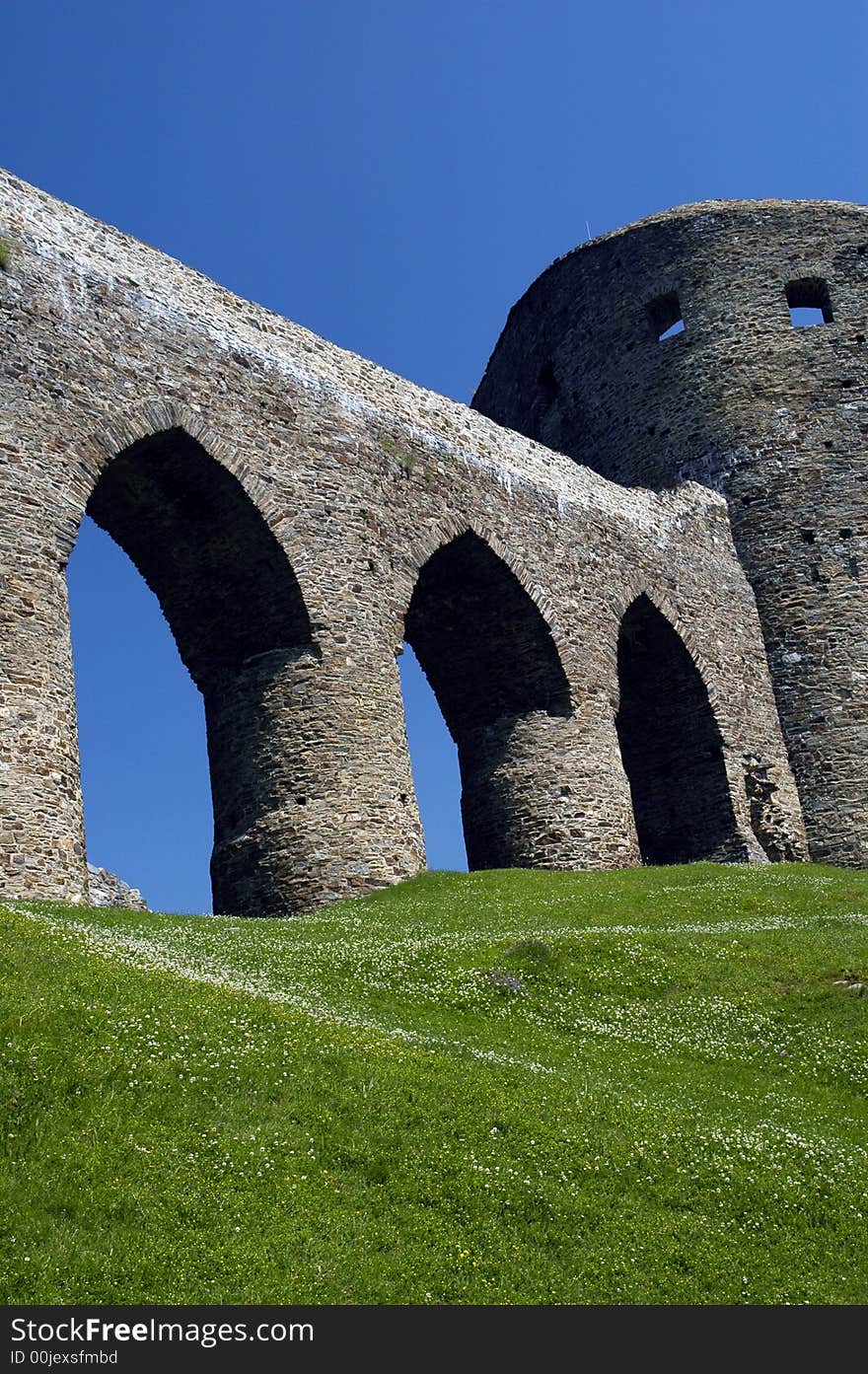 Curtain walls and tower as parts of gothic castle ruin. Curtain walls and tower as parts of gothic castle ruin