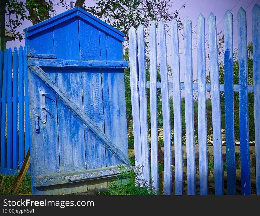 Old blue gate and fence