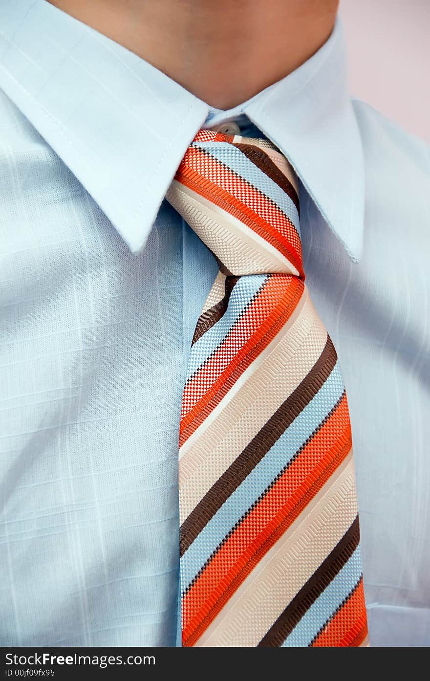 Detail of a business man with coloured tie. Detail of a business man with coloured tie