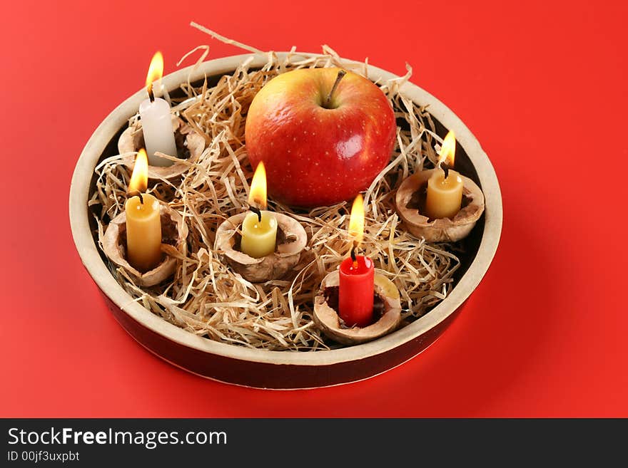 Christmas candlestick on the red background