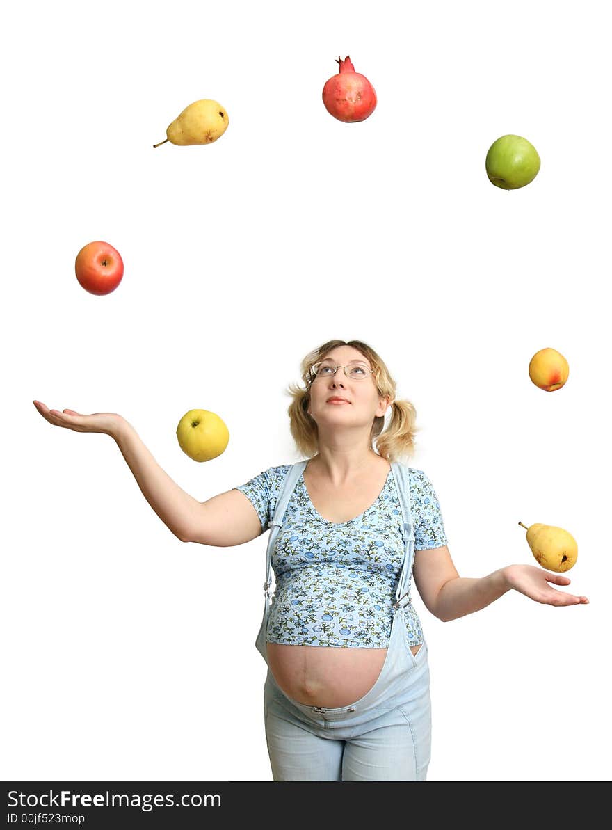 The Expectant mother tosses and caughts the fruits on white background. The Expectant mother tosses and caughts the fruits on white background.