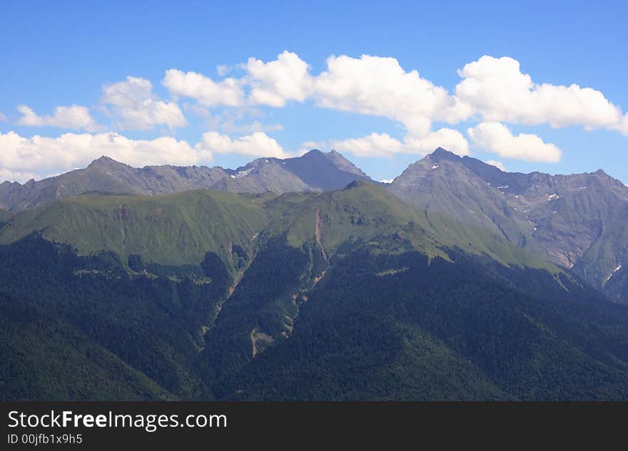 Mountain ridge of Caucasus in summer day. Mountain ridge of Caucasus in summer day